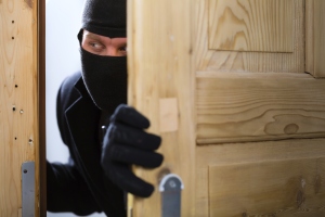 burglary-crime-burglar-opening-a-door-183991278